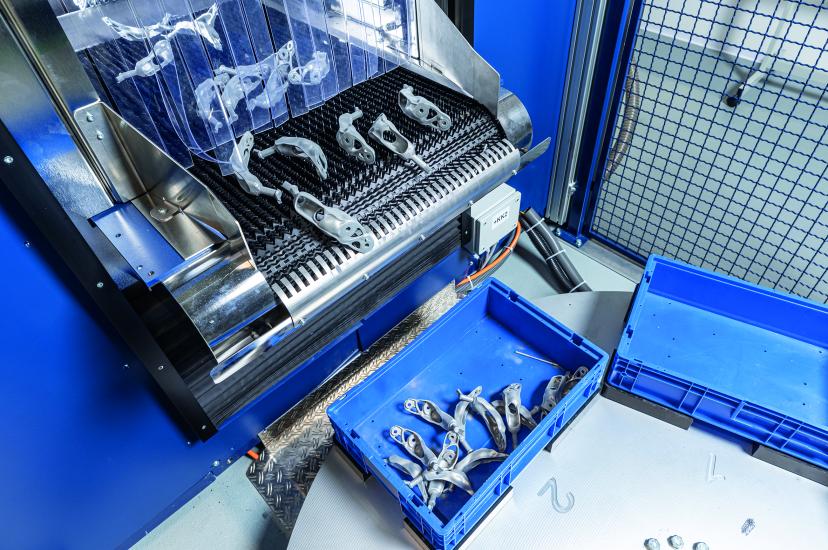BMW 3D-printed components on a conveyor belt 