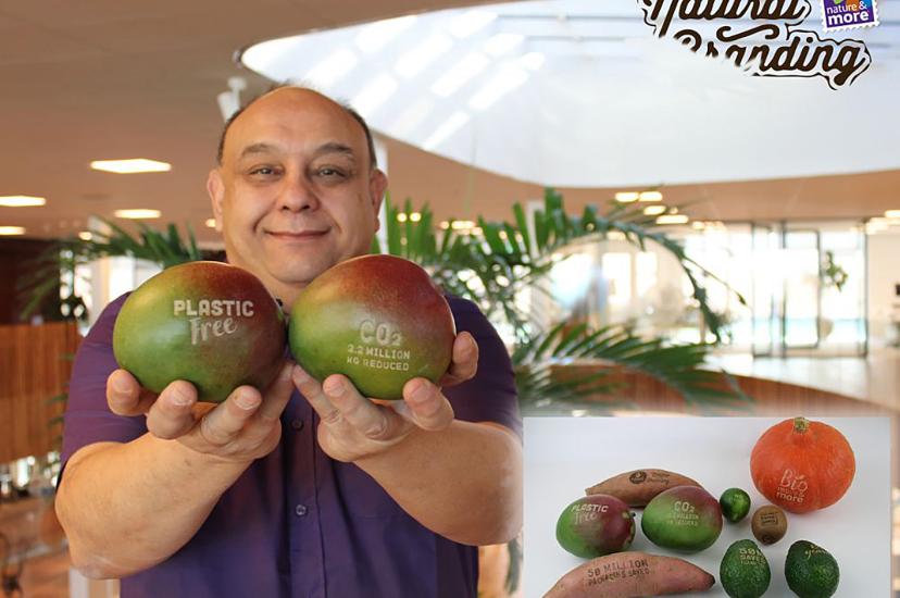 Man holding laser marked fruit
