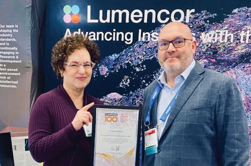 Lumencor Chief Commercial Officer Claudia Jaffe receives her Photonics100 certificate from Europa Science’s Mark Elliott at Photonics West 2023