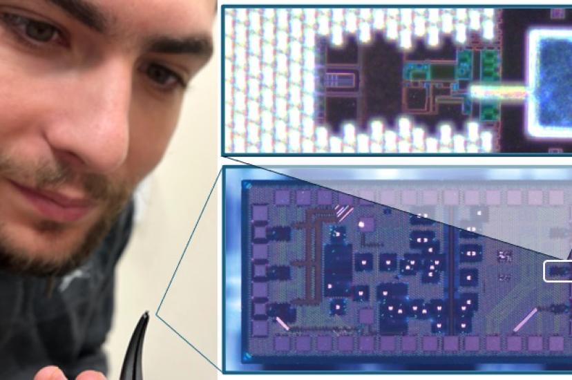 University of Bristol's Dr Giacomo Ferranti holds up a silicon electronic-photonic quantum chip