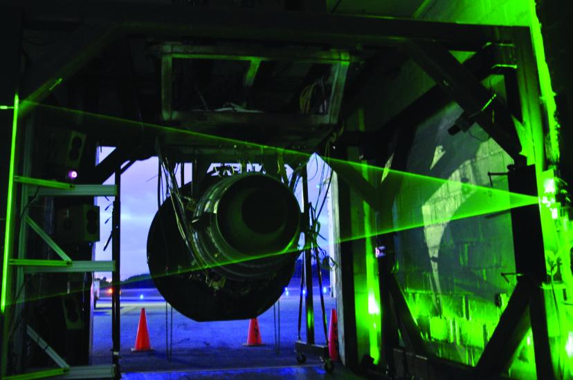 A jet engine exhaust being tested with a laser beam