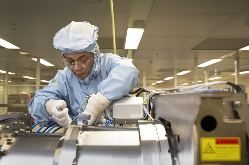 DUV engineer assembling ASML illumination module