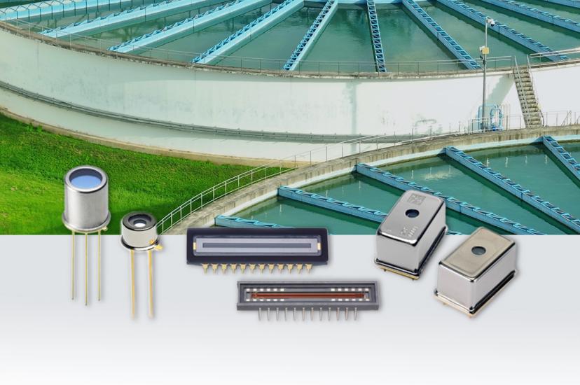 Water treatment facility with rectangular clarification basins shown above various electronic sensors including photodiodes, LED displays, and metal-cased components used for water quality monitoring