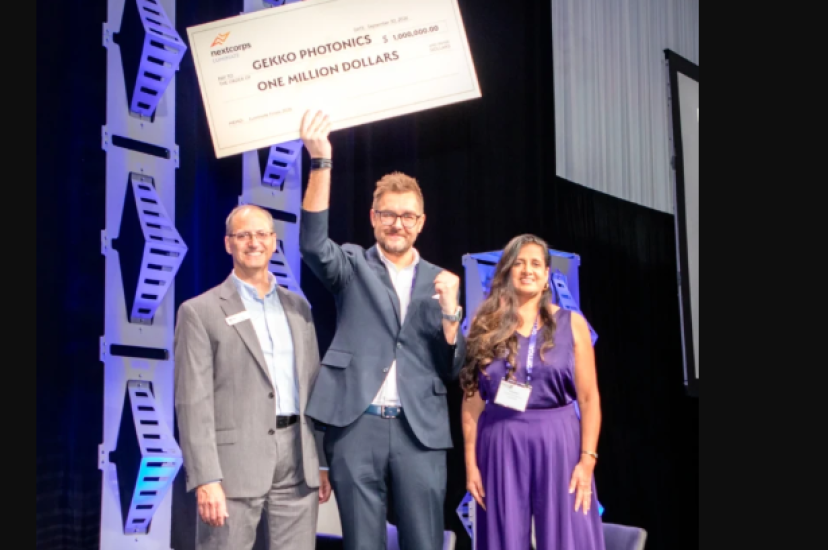 Gekko Photonics wins Luminate NY holds cheque aloft on stage