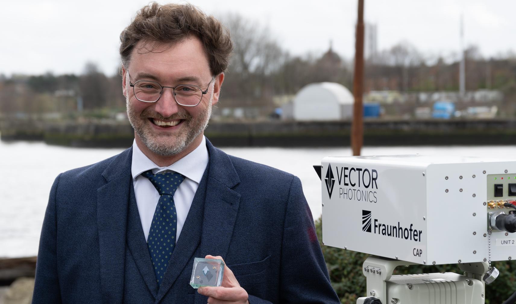 Dr Richard Taylor, CEO and Founder of Vector Photonics, with the PCSEL and optical communications system at the successful demo across the River Clyde.