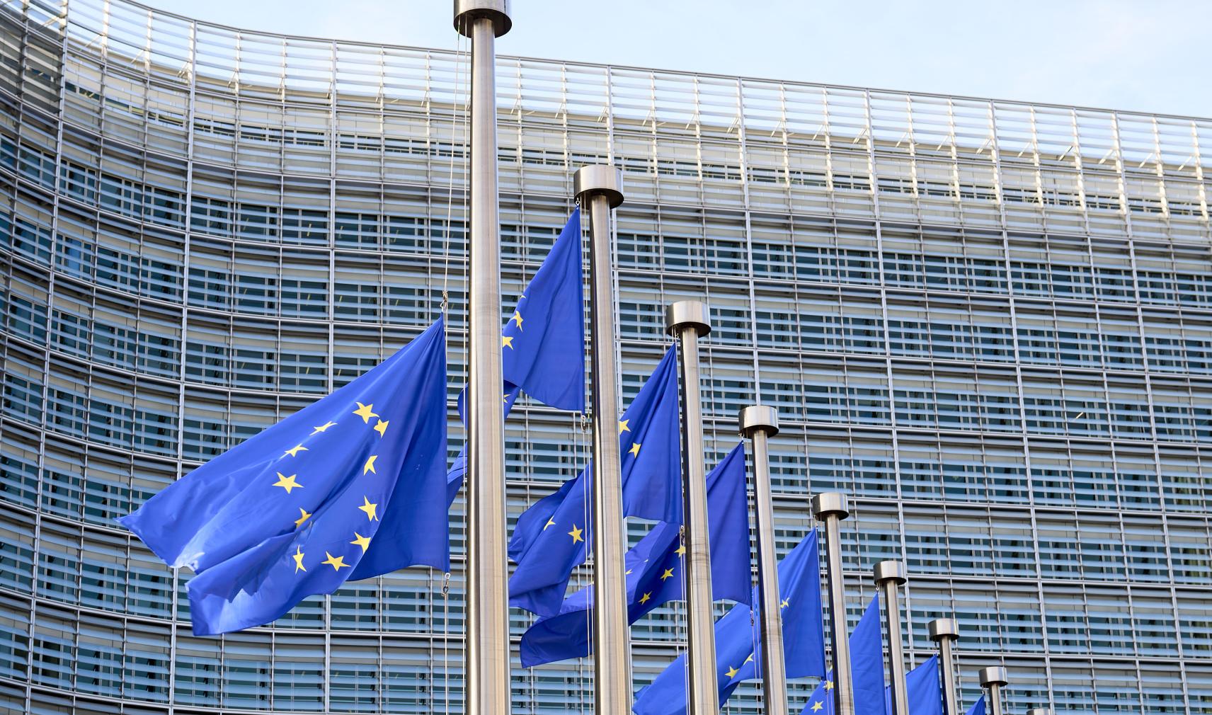European flags waving in front of Berlaymont Building, the European Commission Headquarters