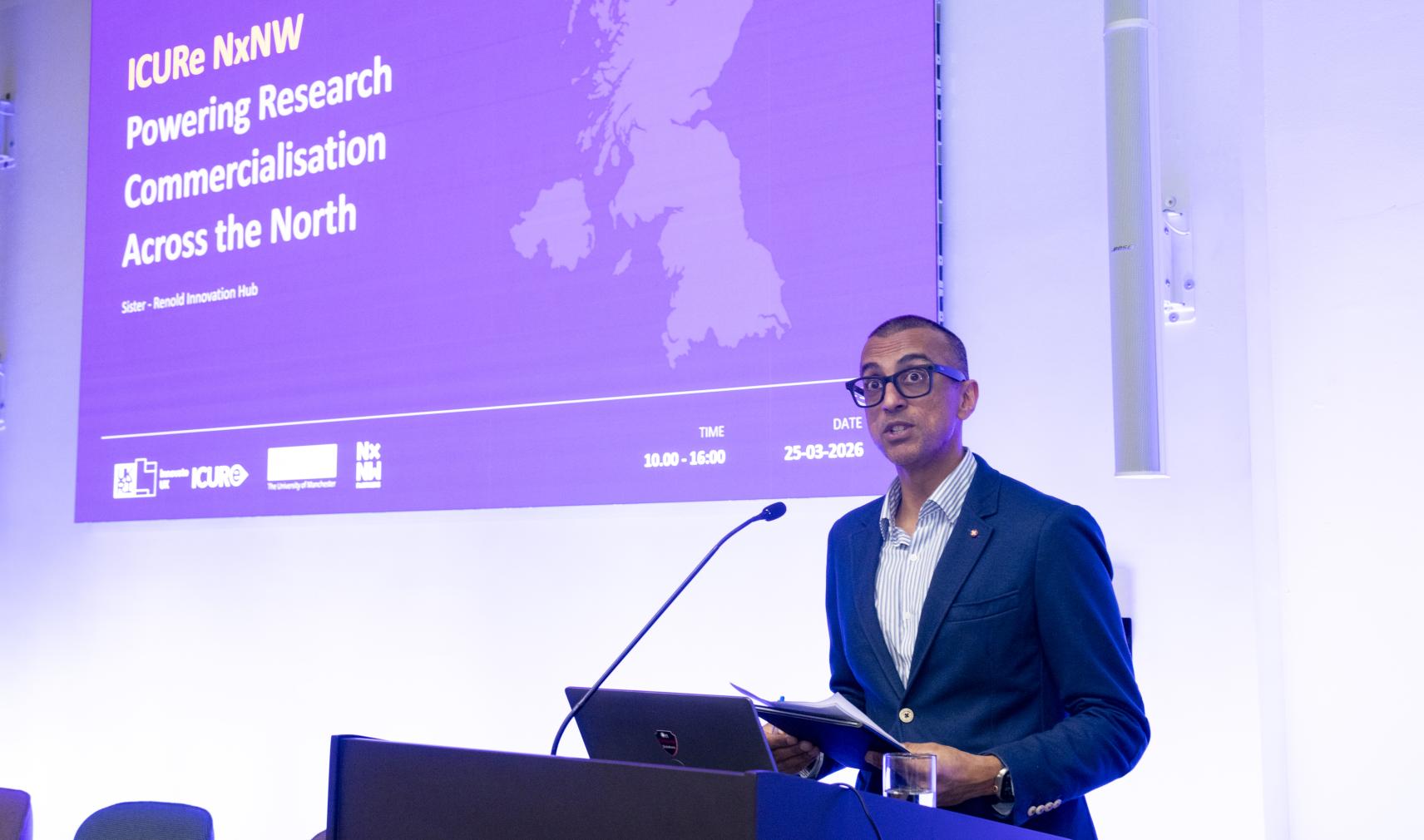 Vikas Shah, speaking at a lecturn