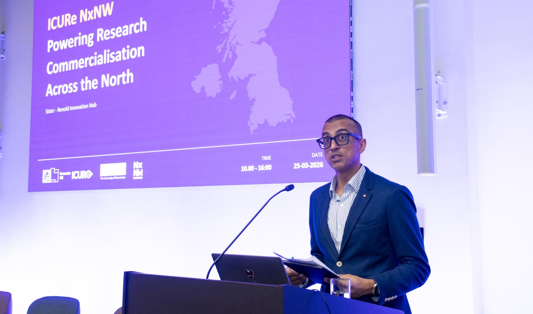 Vikas Shah, speaking at a lecturn