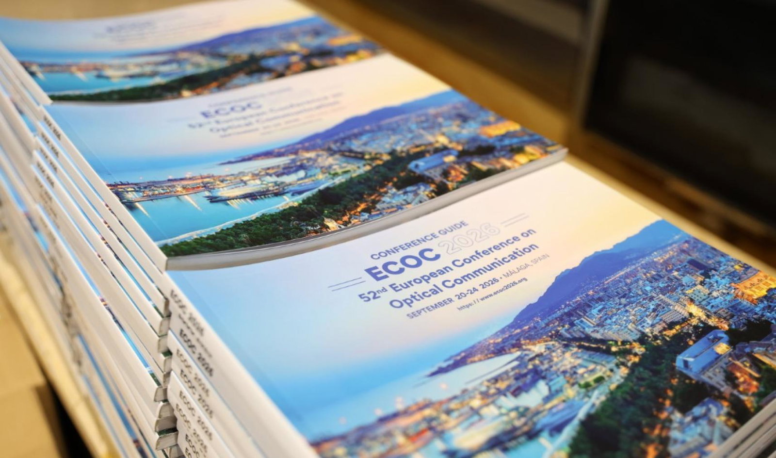 ECOC 2026 brochure in stacks during the event