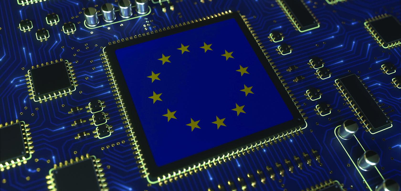 “The EU has a vibrant and growing integrated photonics industry. However, without volume manufacturing, testing, and packaging capacity, we are incredibly vulnerable…” (Image: Shutterstock/Novikov Aleksey) EU flag on semiconductor chip