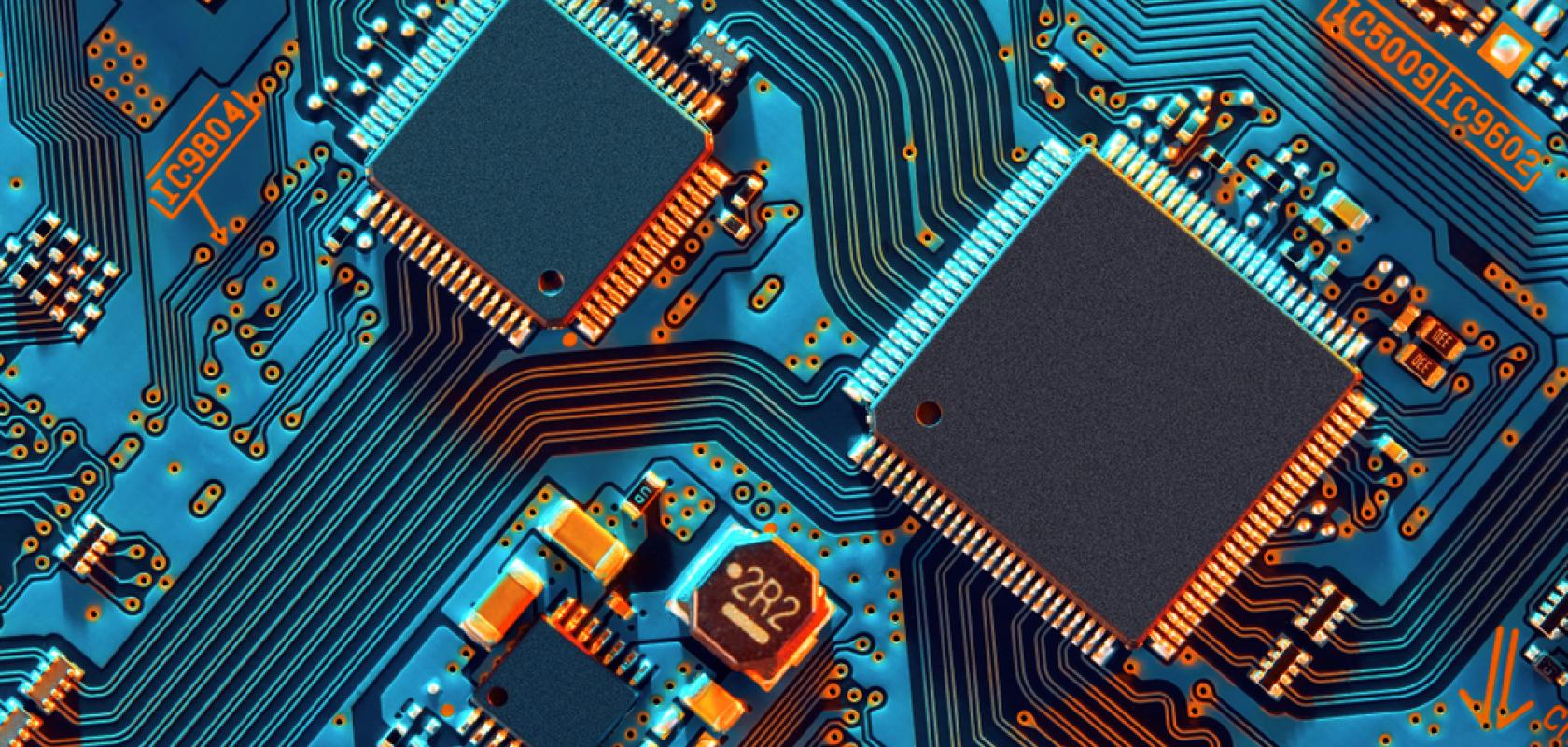 A circuit board under blue light.