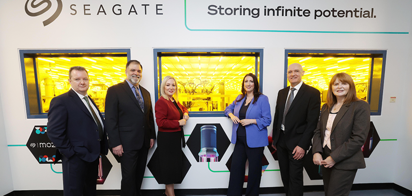 Kieran Donoghue, CEO, Invest NI; John Morris, CTO, Seagate; Michelle O’Neill, NI First Minister; Emma Little-Pengelly, NI Deputy First Minister; Fergus O’Donnell, VP of Wafer Operations NI, Seagate and NI Economy Minister, Dr. Caoimhe Archibald