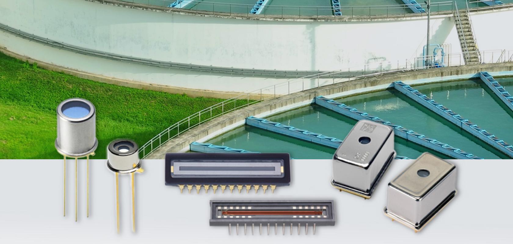 Water treatment facility with rectangular clarification basins shown above various electronic sensors including photodiodes, LED displays, and metal-cased components used for water quality monitoring