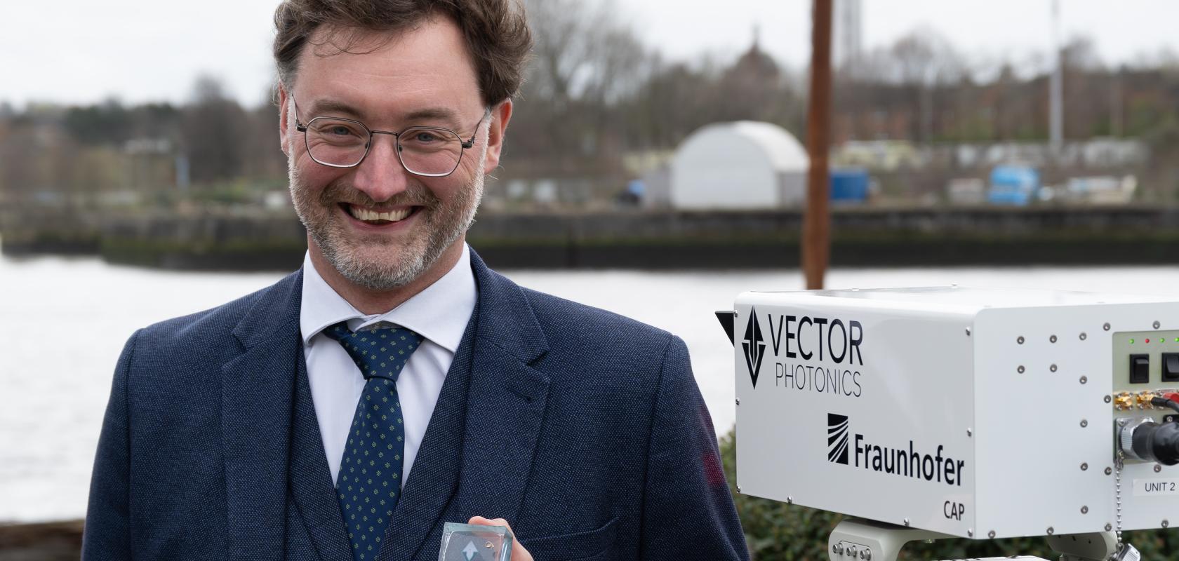 Dr Richard Taylor, CEO and Founder of Vector Photonics, with the PCSEL and optical communications system at the successful demo across the River Clyde.
