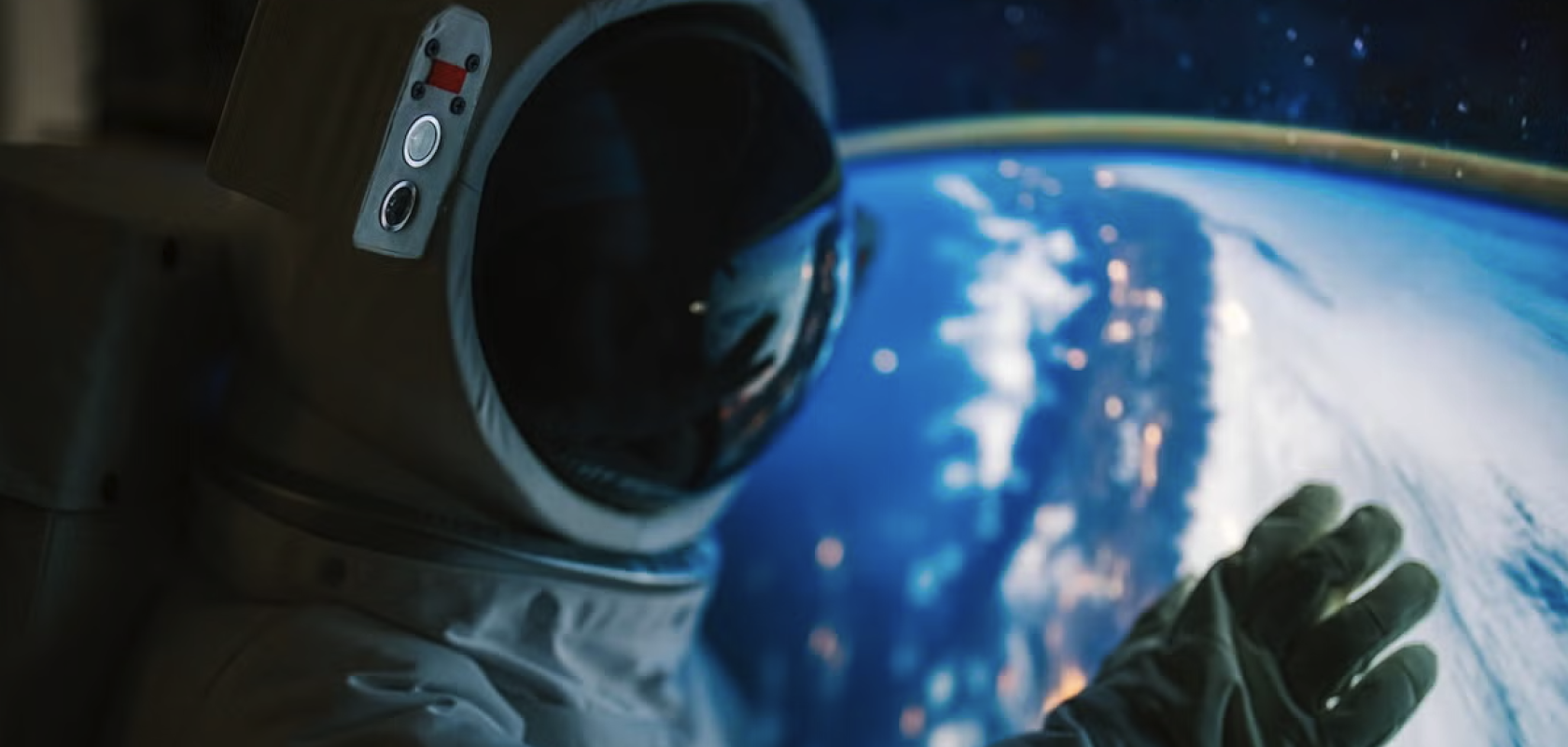Person in spacesuit in front of image of Earth