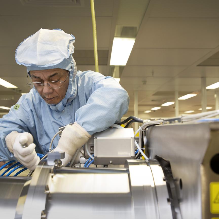 DUV engineer assembling ASML illumination module