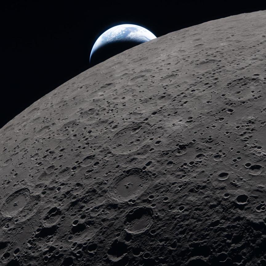 Lunar surface with a distant Earthset in the background