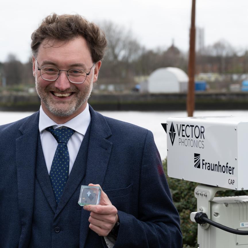 Dr Richard Taylor, CEO and Founder of Vector Photonics, with the PCSEL and optical communications system at the successful demo across the River Clyde.