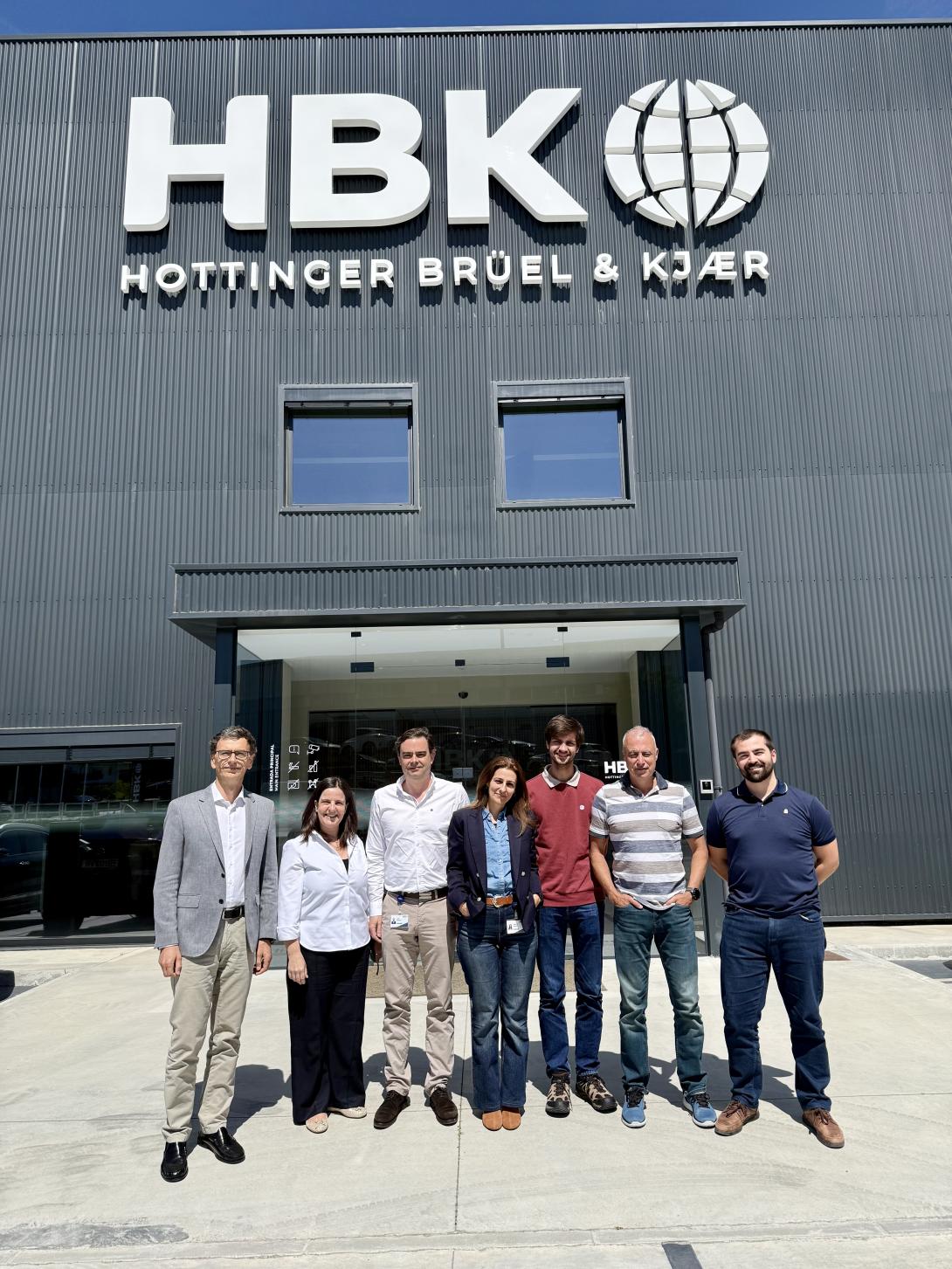 Some members of the HBK FiberSensing team, stood outside the company building