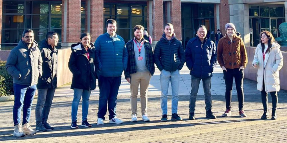 A group of people outside Queen’s University Belfast’s McClay Library
